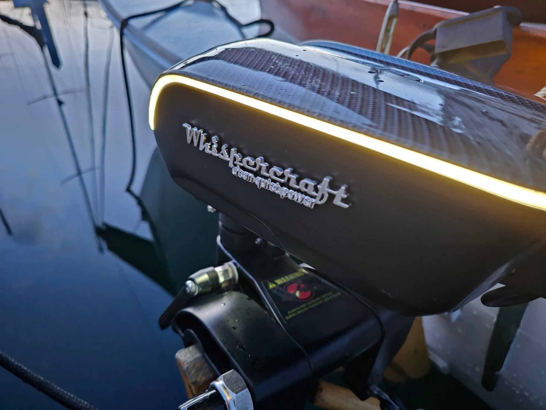 Whispercraft electric outboard motor at dusk